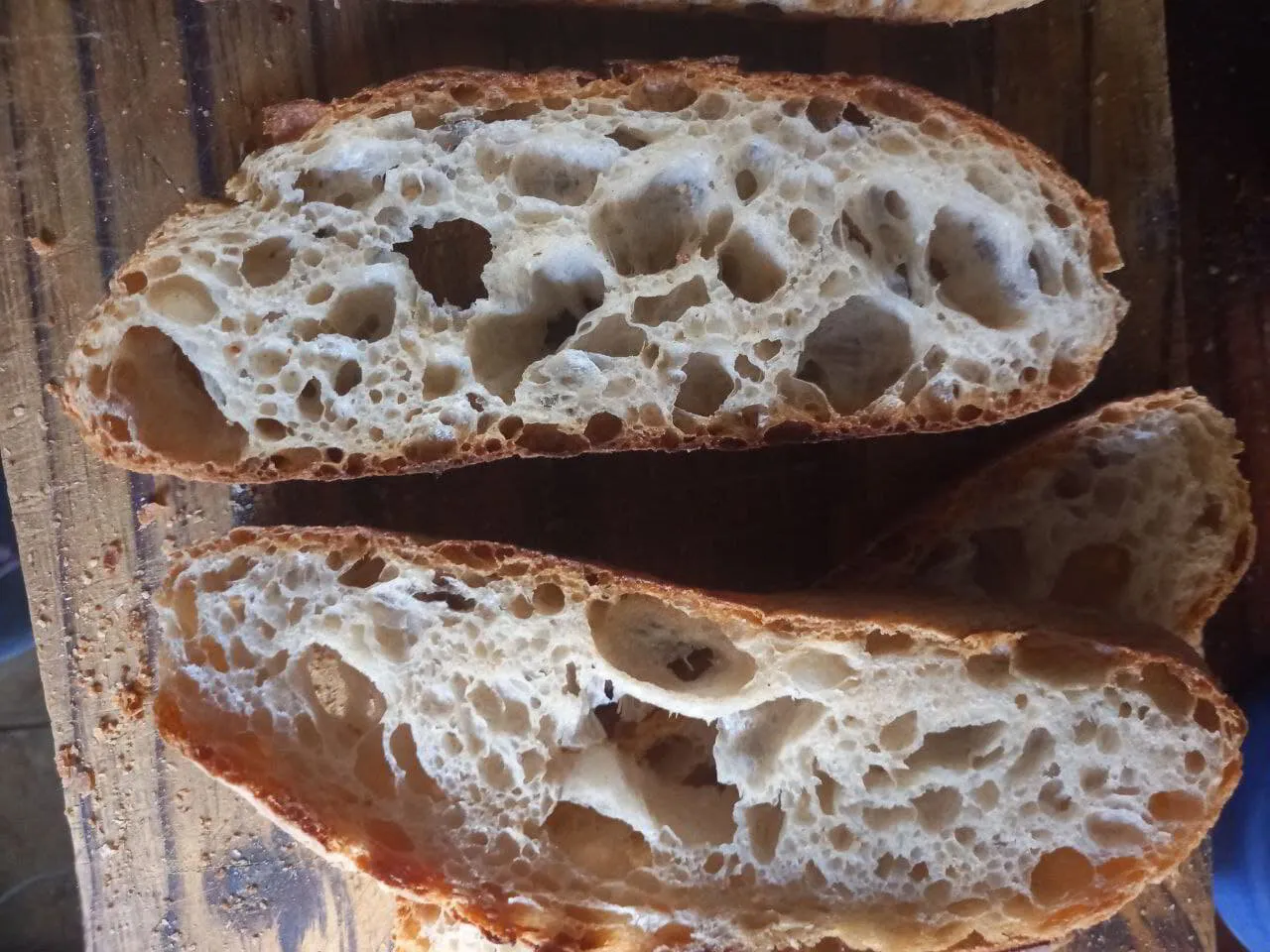 The irregular open crumb of a ciabatta loaf