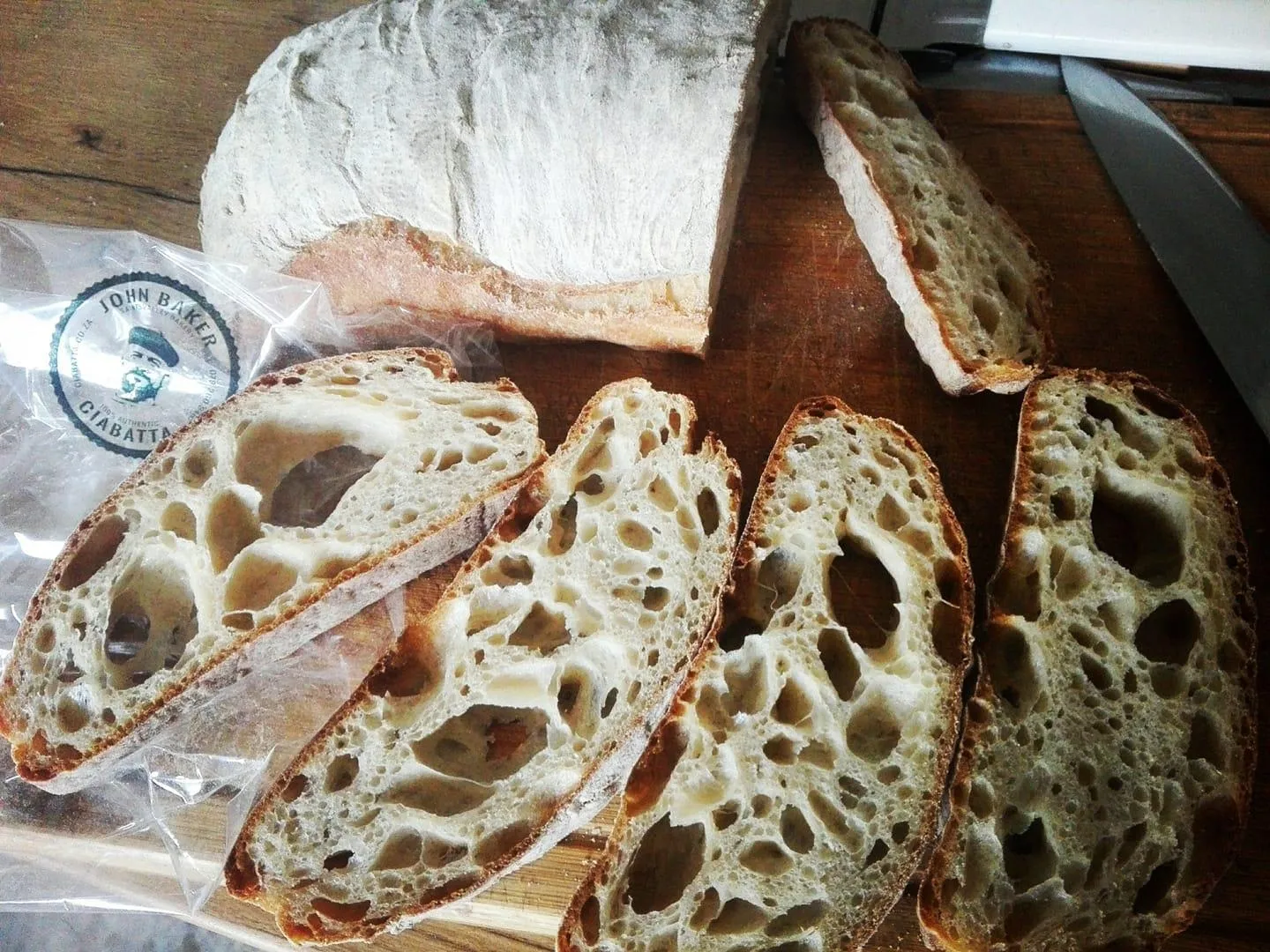 Fresh ciabatta loaves with a flour-dusted crust